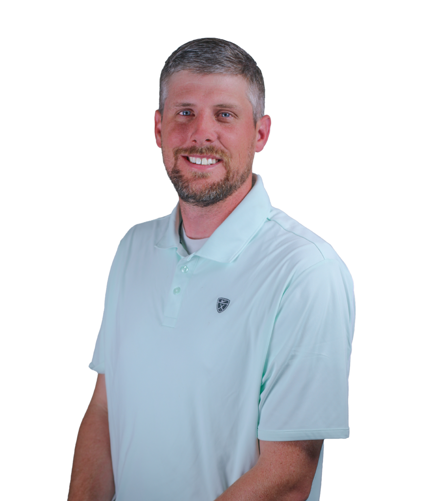 Smiling man in a light blue polo shirt, facing the camera (portrait shot).